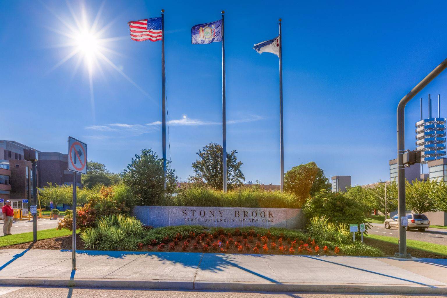 Entrance to Stony Brook Campus with flags flying