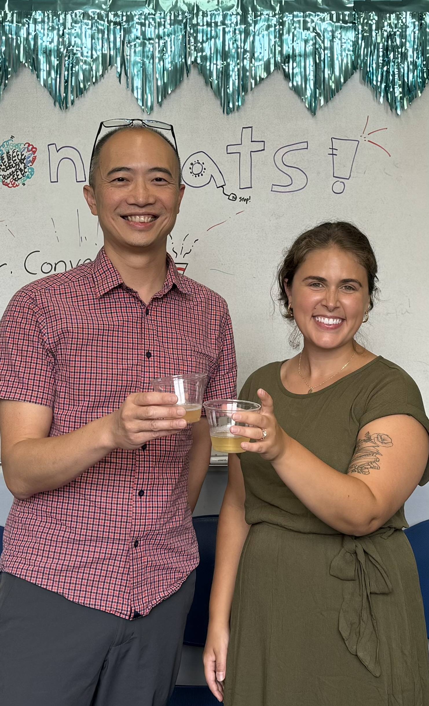 Cynthia Converso and mentor Ed Luck celebrate Cynthia's PhD thesis defense