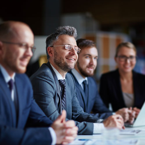 Three business people sitting at a table