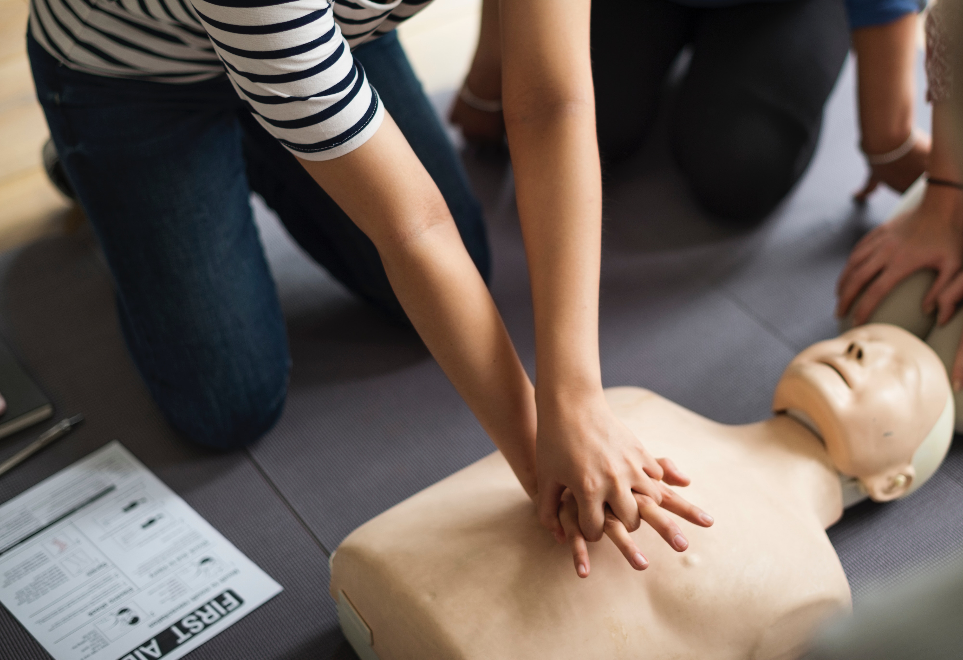cpr being performed on a training dummy