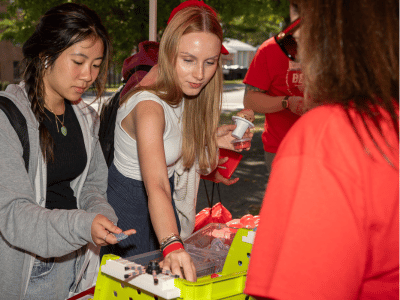 student picking up health product at fair