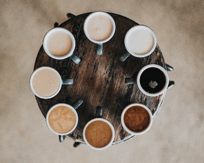 image of coffee cups circled around a small table